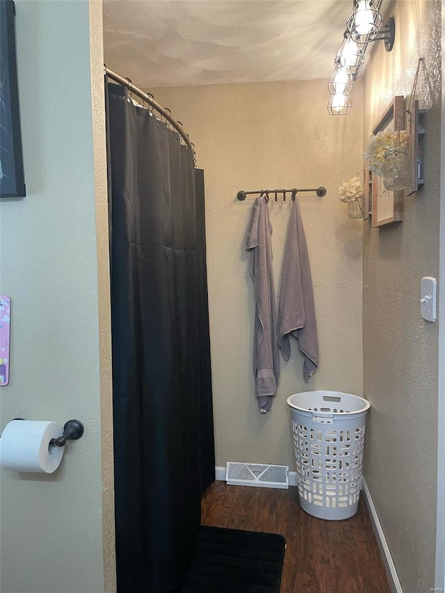 bathroom featuring hardwood / wood-style floors