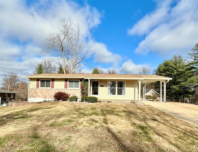 single story home with a front yard and a carport