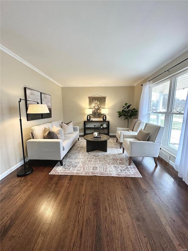 living room with dark hardwood / wood-style flooring and ornamental molding