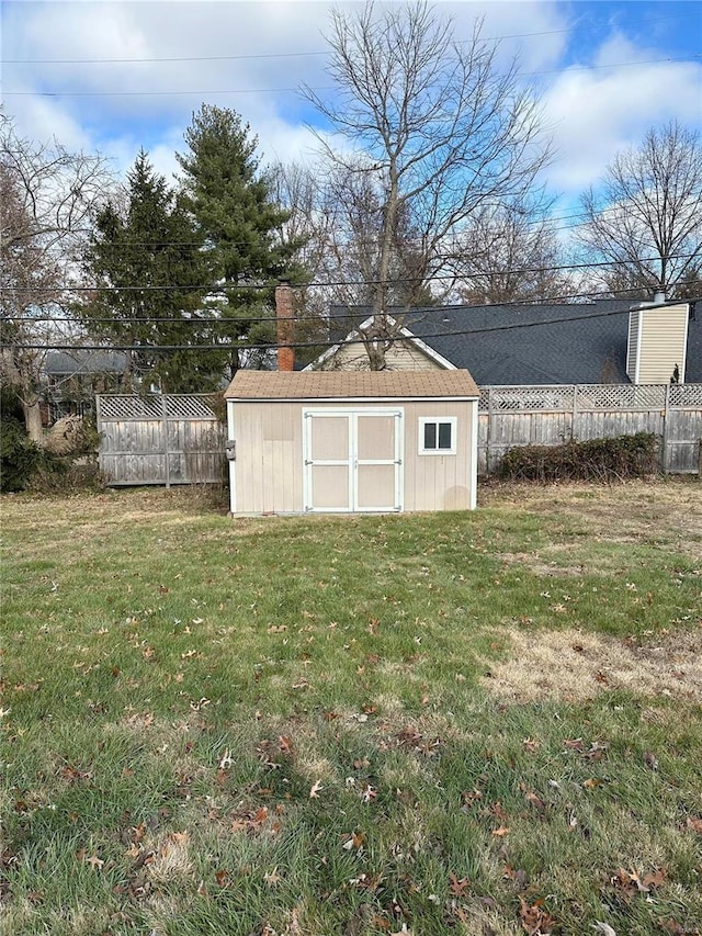 view of outbuilding featuring a yard