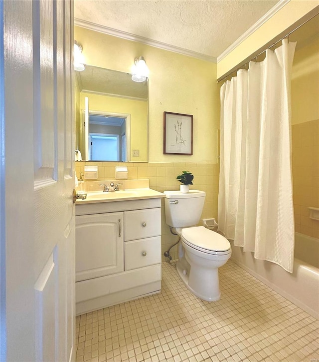 full bathroom with tile patterned flooring, ornamental molding, tile walls, and a textured ceiling