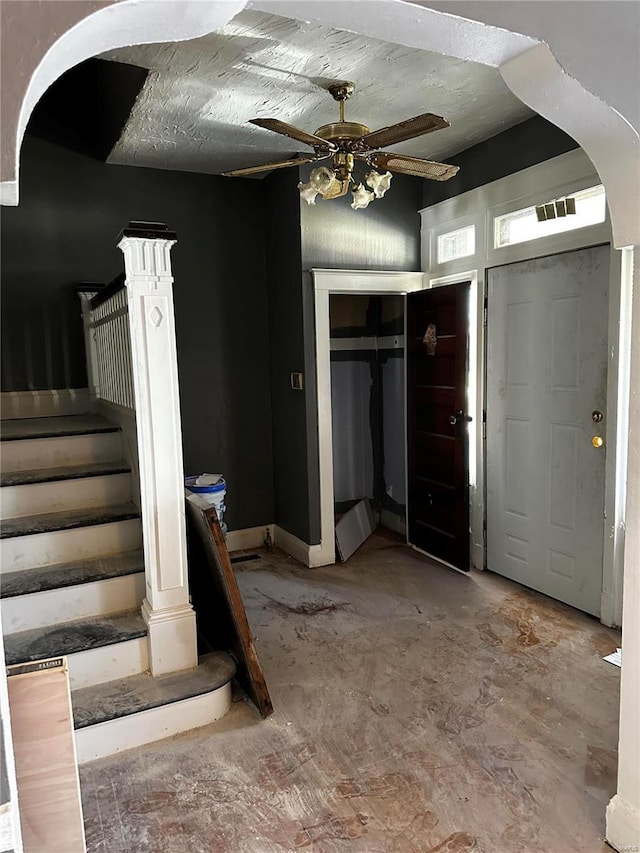 entrance foyer with ceiling fan