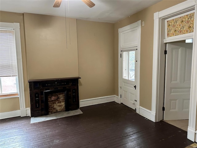 unfurnished living room featuring dark hardwood / wood-style floors and ceiling fan