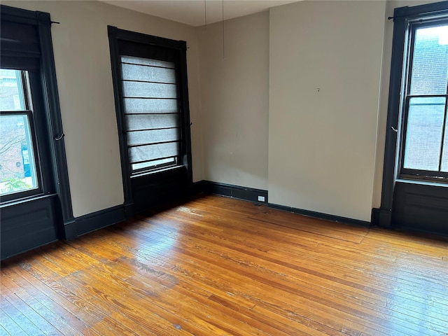 unfurnished room featuring light hardwood / wood-style flooring