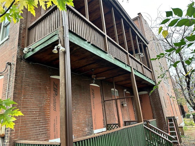 view of side of home with ceiling fan