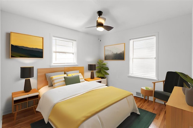 bedroom featuring hardwood / wood-style flooring and ceiling fan