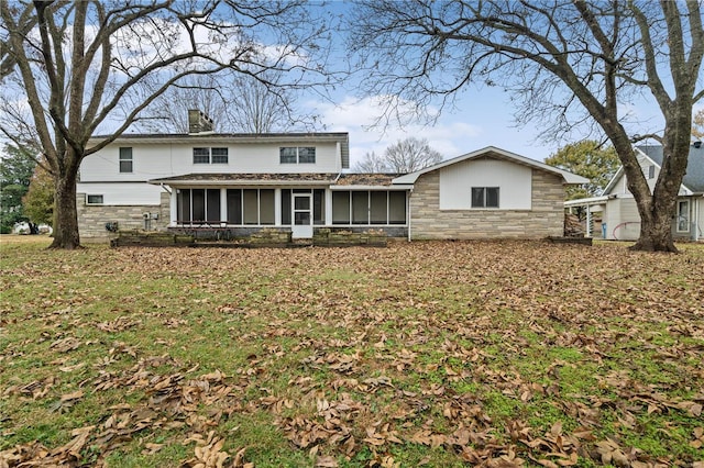 view of front of house with a sunroom