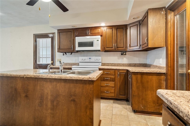 kitchen featuring ceiling fan, sink, backsplash, white appliances, and light tile patterned flooring