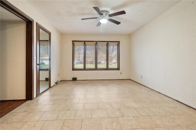 unfurnished room featuring ceiling fan