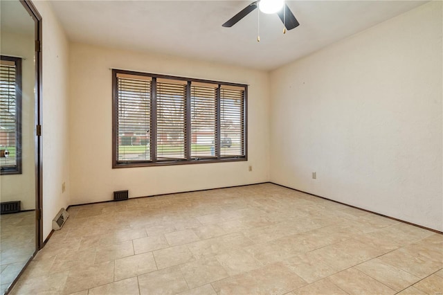 spare room with ceiling fan