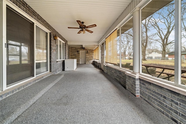 unfurnished sunroom with wood ceiling