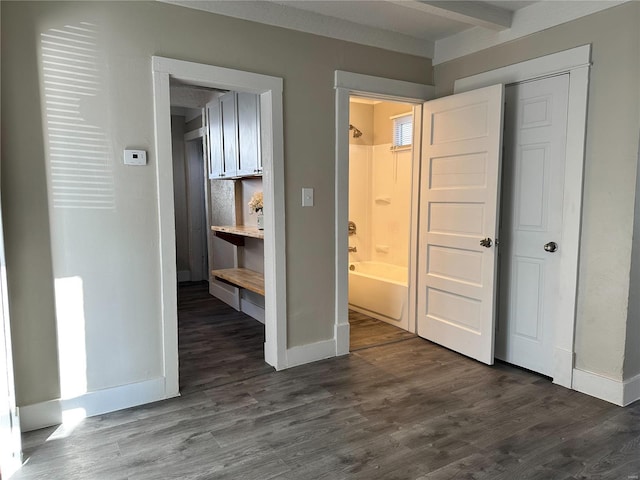 hall with dark hardwood / wood-style flooring