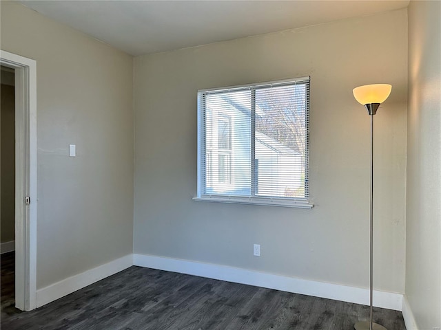 empty room with dark wood-type flooring