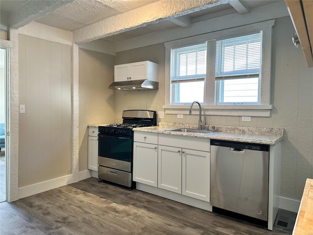 kitchen featuring white cabinets, sink, appliances with stainless steel finishes, and dark wood-type flooring