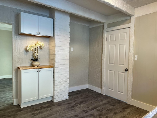 interior space with dark hardwood / wood-style flooring