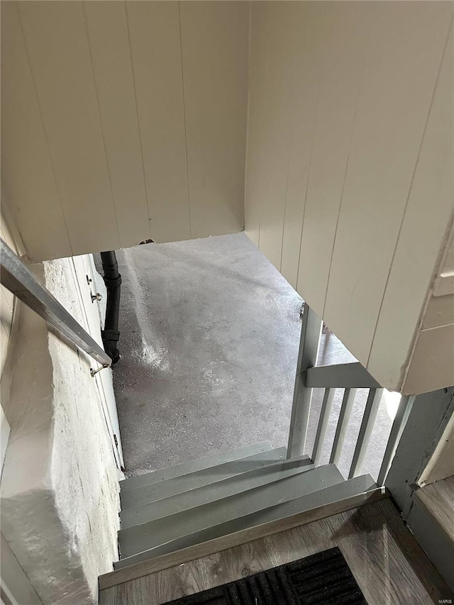 stairway with concrete floors