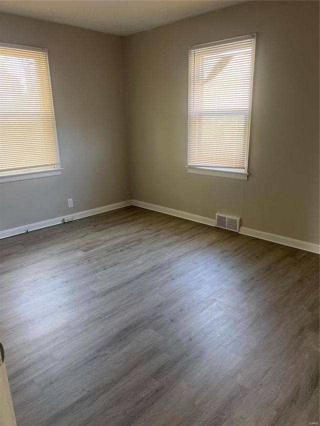 spare room featuring hardwood / wood-style floors