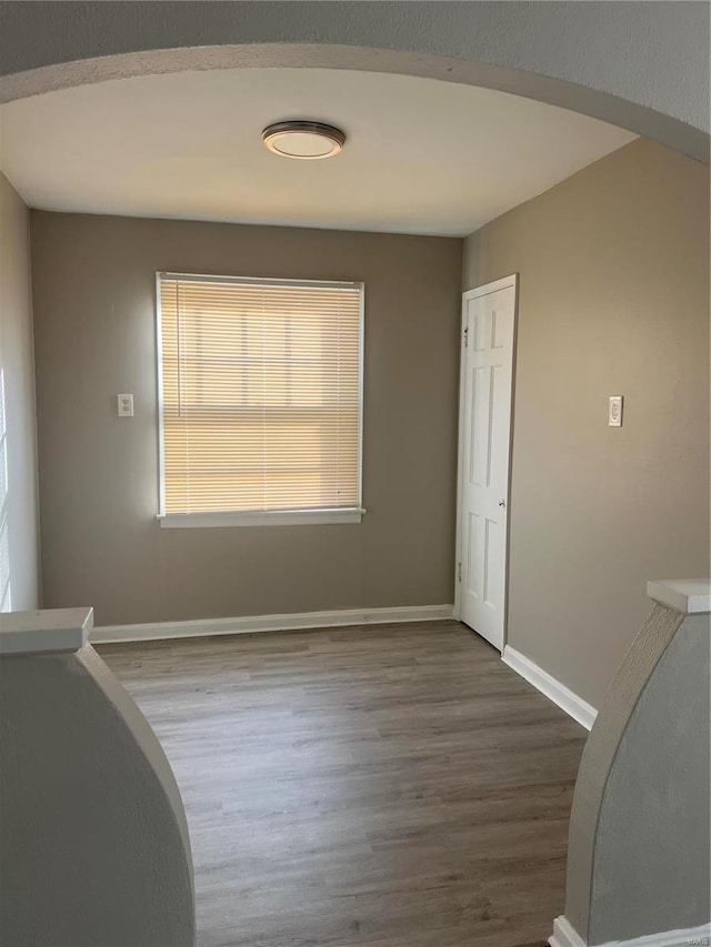 empty room with wood-type flooring