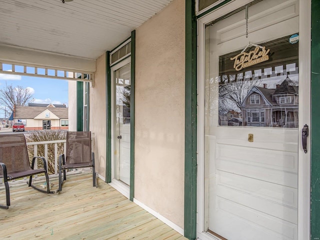 doorway to property featuring a porch