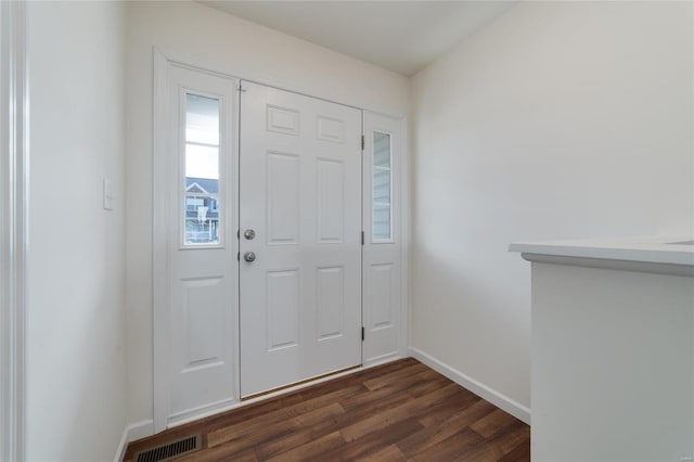 entrance foyer with dark hardwood / wood-style flooring