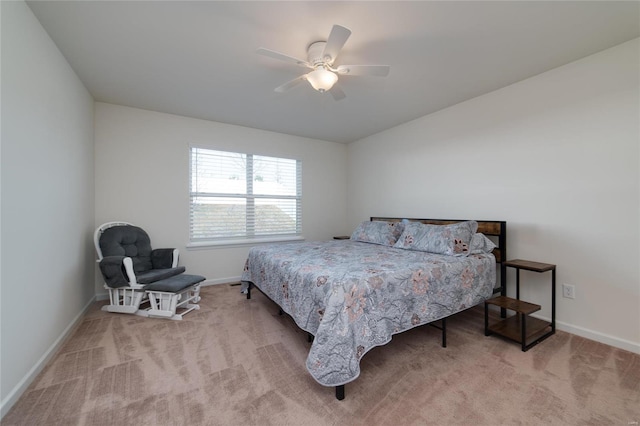 bedroom featuring ceiling fan and light carpet