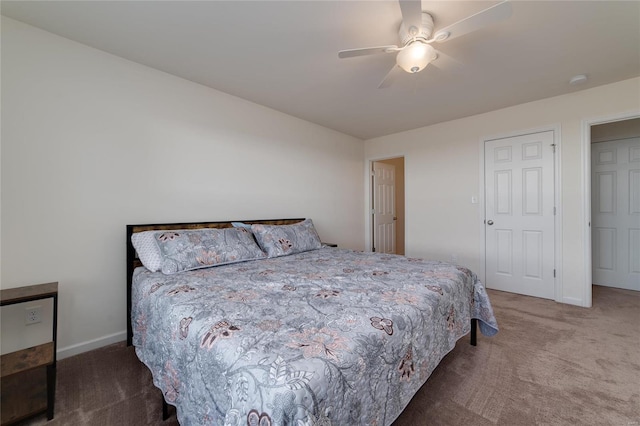 bedroom featuring ceiling fan and dark colored carpet