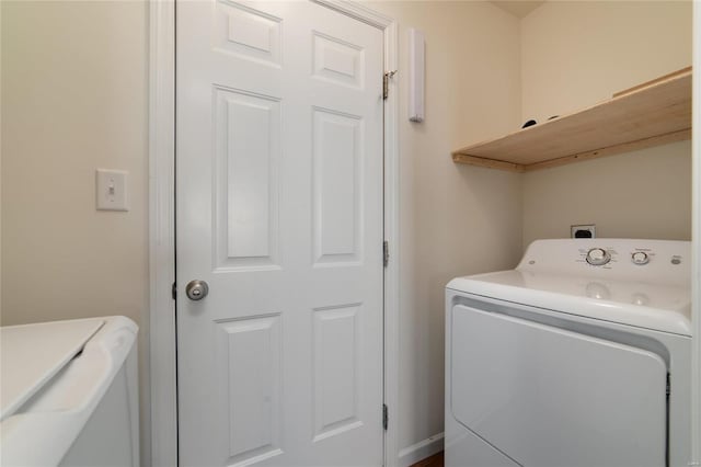 washroom featuring washer and dryer