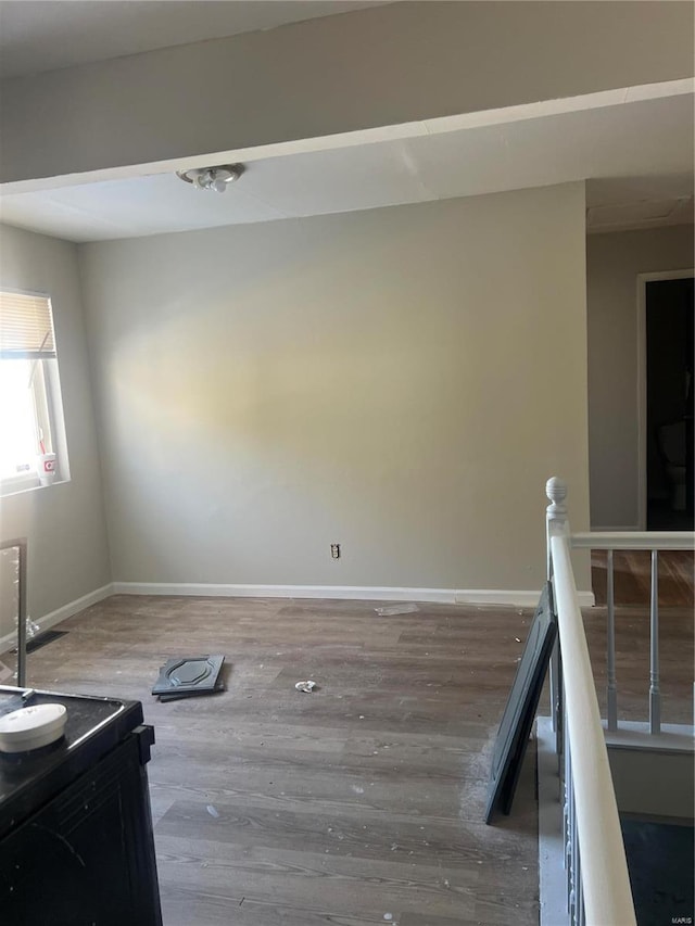 unfurnished room featuring wood-type flooring