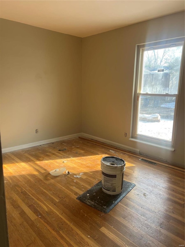 empty room featuring hardwood / wood-style flooring