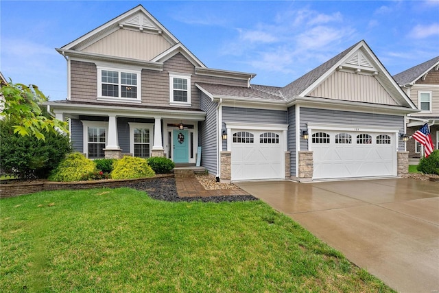 craftsman-style house featuring a porch, a garage, and a front lawn