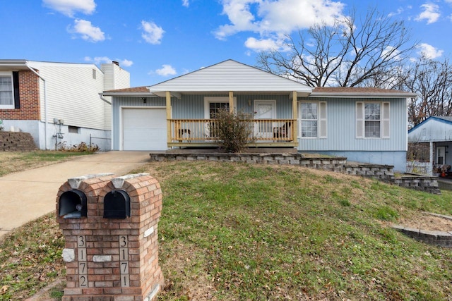 view of front facade featuring a front yard, a garage, and covered porch