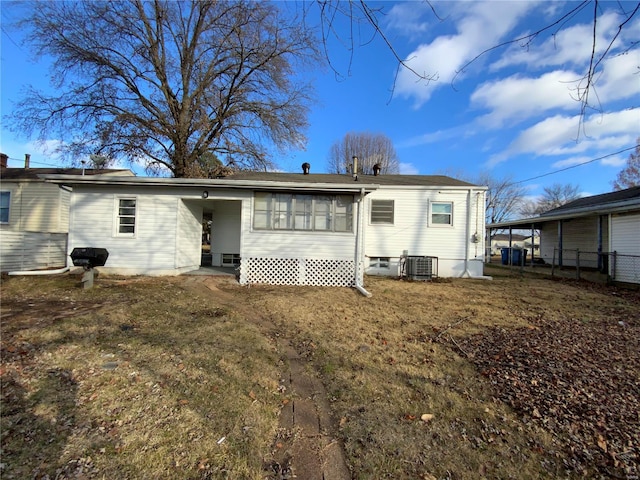 rear view of property with a carport