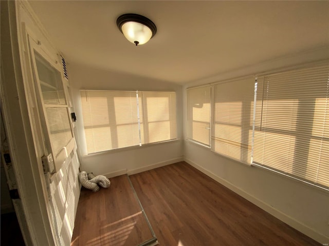 unfurnished sunroom with vaulted ceiling