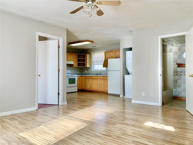 kitchen with white appliances, sink, ceiling fan, light wood-type flooring, and a textured ceiling