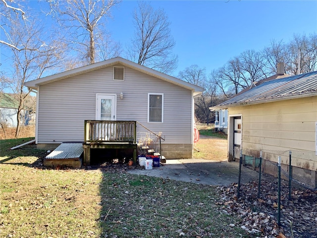 back of house with a yard