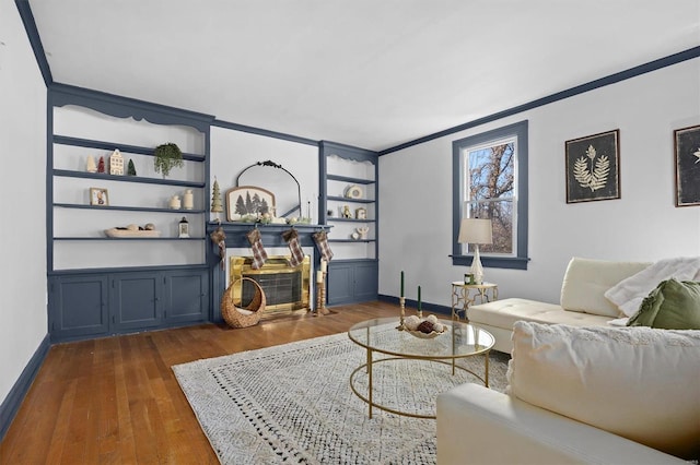 living room featuring crown molding and dark hardwood / wood-style flooring