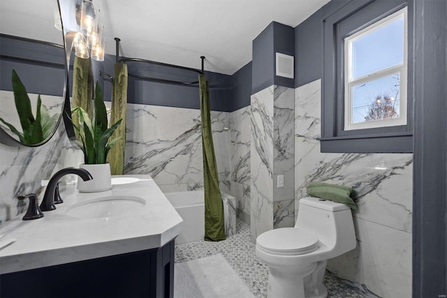 bathroom featuring vanity, curtained shower, and tile walls