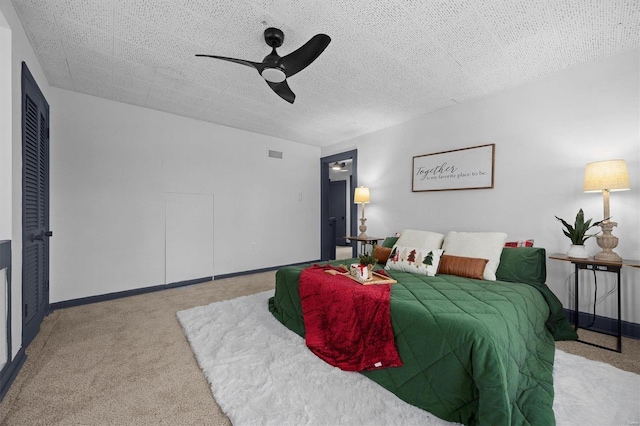 carpeted bedroom with ceiling fan