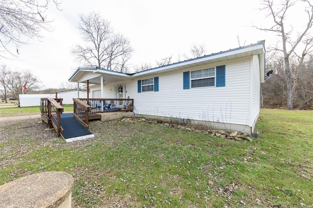 back of house with a porch and a lawn