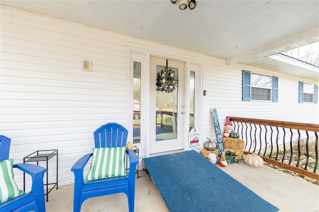 property entrance with covered porch