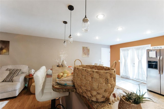 dining space with light hardwood / wood-style floors