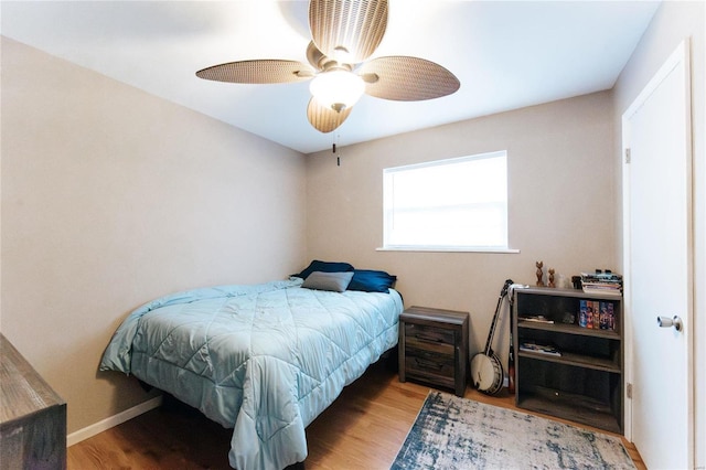 bedroom featuring ceiling fan and light hardwood / wood-style floors