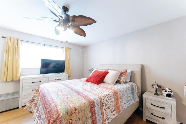 bedroom with light wood-type flooring and ceiling fan