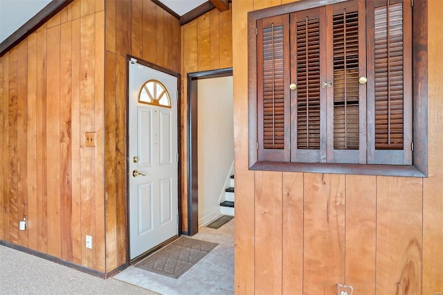 foyer entrance with wood walls