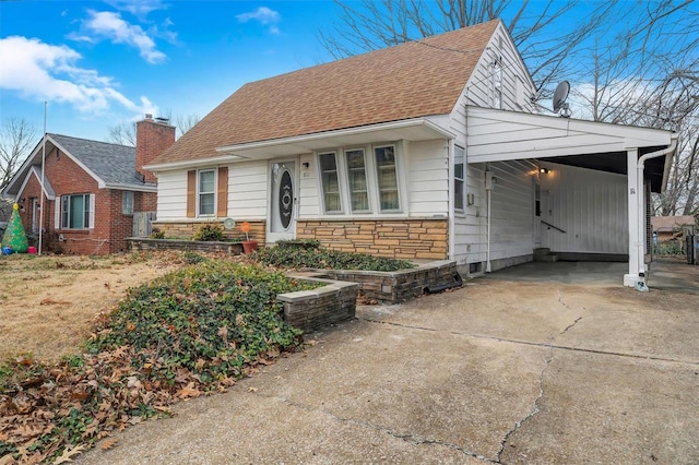 view of front of property with a carport