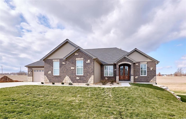 view of front of house with a garage, a front lawn, brick siding, and driveway