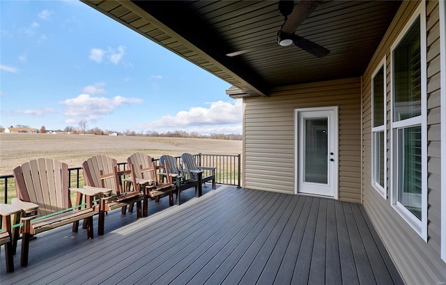 wooden deck featuring a ceiling fan