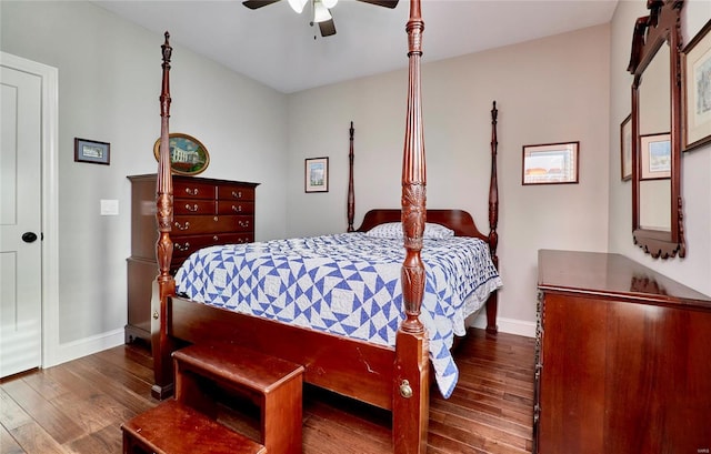 bedroom featuring a ceiling fan, baseboards, and wood finished floors