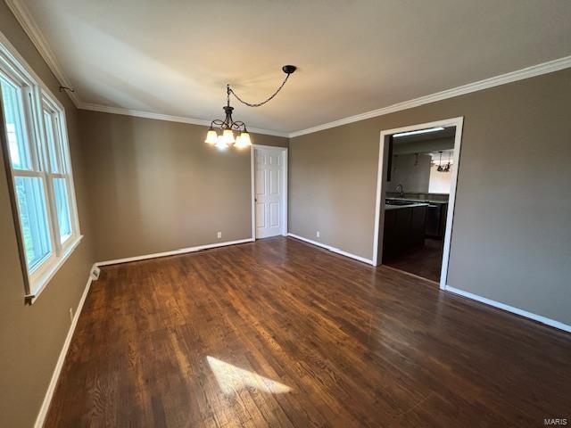 interior space with crown molding, a chandelier, and dark hardwood / wood-style floors