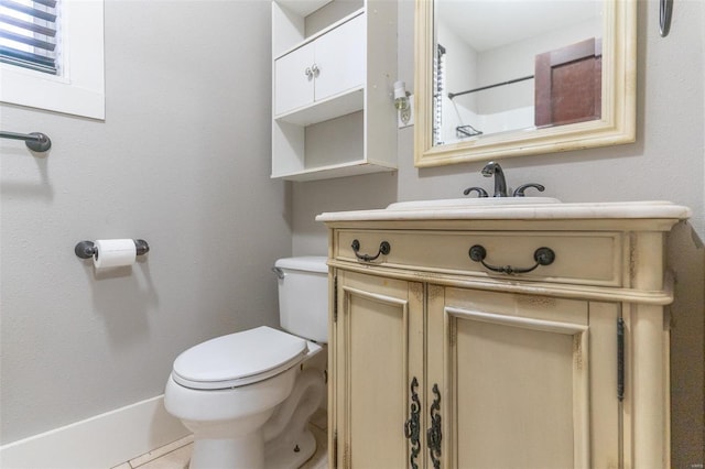 bathroom with tile patterned floors, vanity, and toilet